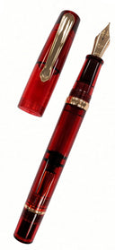 Translucent red Nahvalur Original Fountain Pen featuring a gold-colored nib and cap, designed with a piston filling system.