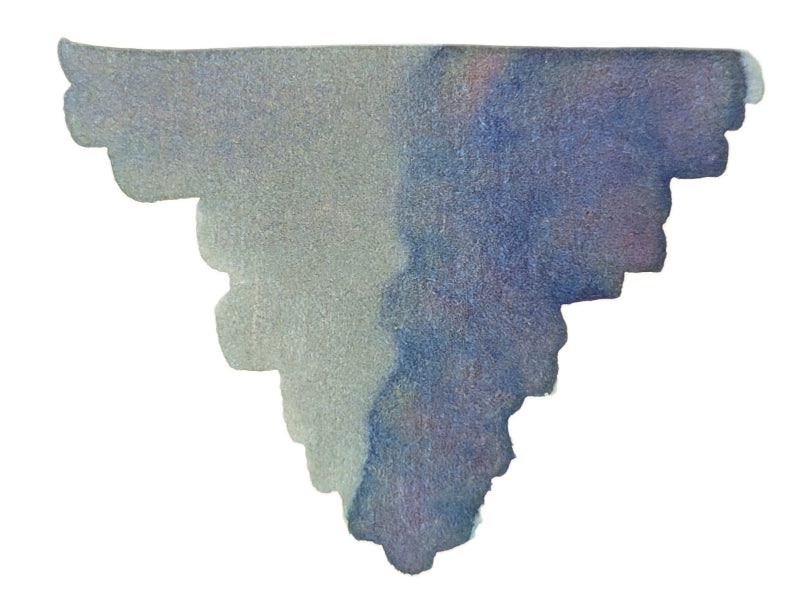 A watercolor shape resembling an upside-down triangle with scalloped, jagged edges and a blend of blue and gray hues, reminiscent of the vibrant tones found in the Colorverse Colorvent Calendar 2025 Top 3 Ink Set.