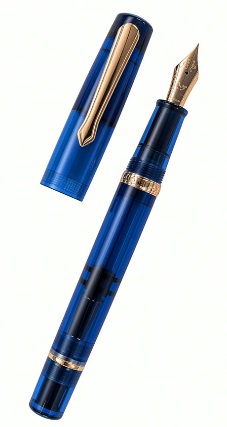 Nahvalur Original Fountain Pen in transparent blue with gold-colored trim, shown with the cap removed from the piston-filled body.
