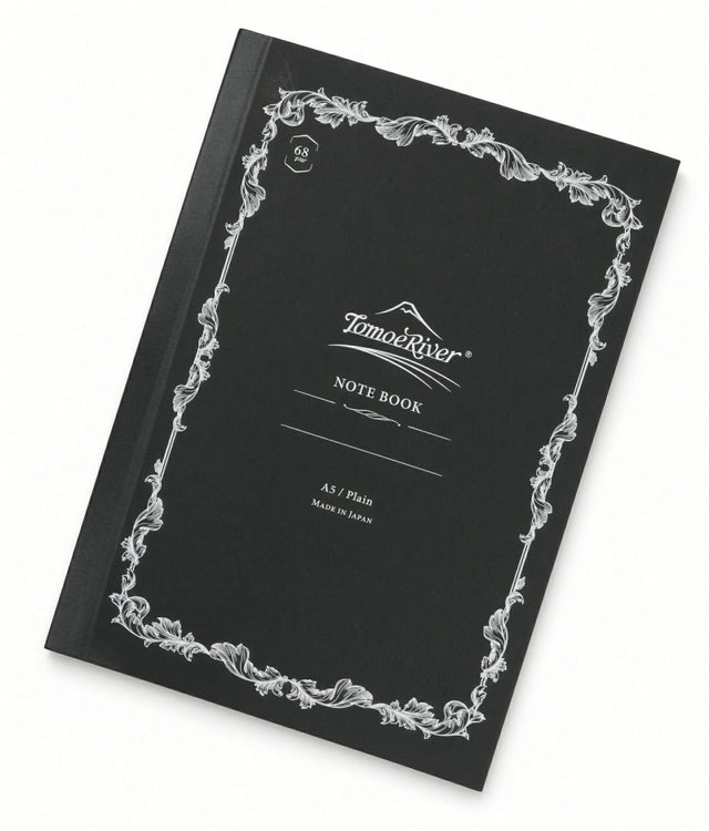 Black A5 Tomoe River Notebook - Blank (68gsm) with a decorative white border, featuring the text Tomoe River, NOTE BOOK, 68 gsm, and A5 / Plain on the cover.