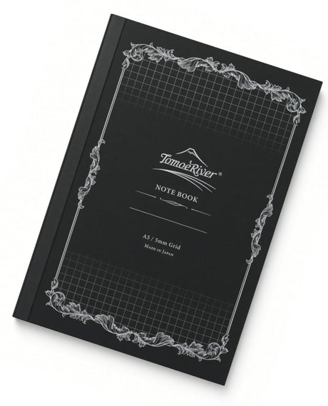 Black Tomoe River A5 Notebook - Graph (52gsm) with a grid pattern on the cover, ornate white decorative borders, and text reading NOTE BOOK and A5 / 5mm Grid.
