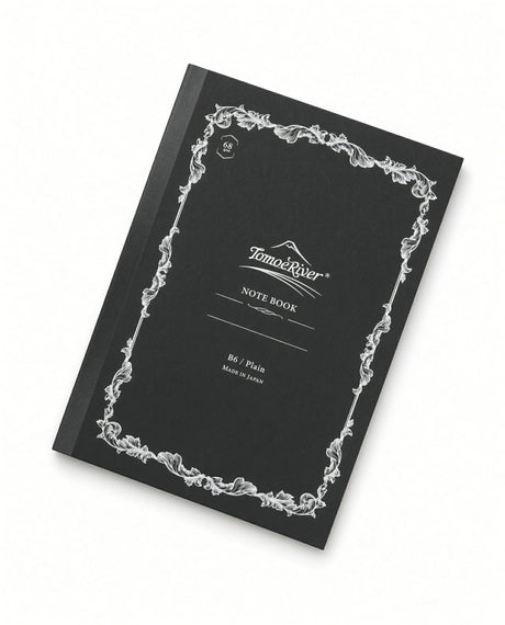 Black B6 Tomoe River B6 Notebook -Blank (68gsm) with a white ornate leaf border and NOTE BOOK printed on the cover, featuring fountain pen friendly paper.