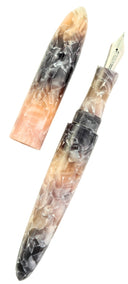 The Ranga Giant 9B Fountain Pen, crafted from acrylic and ebonite in a marbled blend of pink, gray, and beige tones, is displayed with its cap removed and set beside the pen.